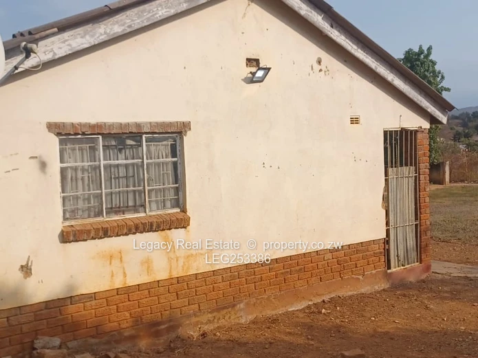 Walled 2-Bed Home on 2300m² with Verandah & Main Road Frontage (Sole Mandate)