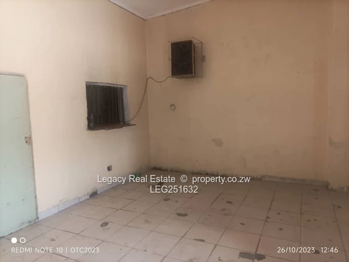Tiled, High-Ceiling Retail Shop with Service Hatch — Chitungwiza